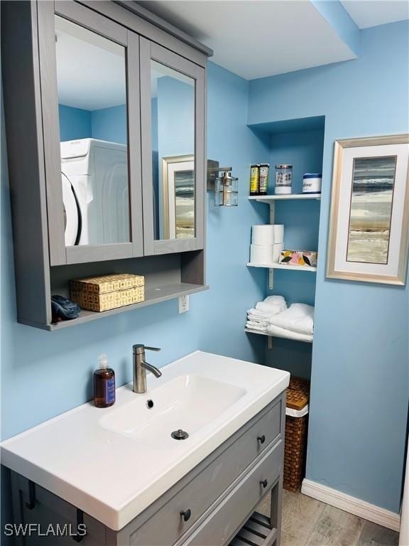 bathroom featuring wood finished floors and vanity