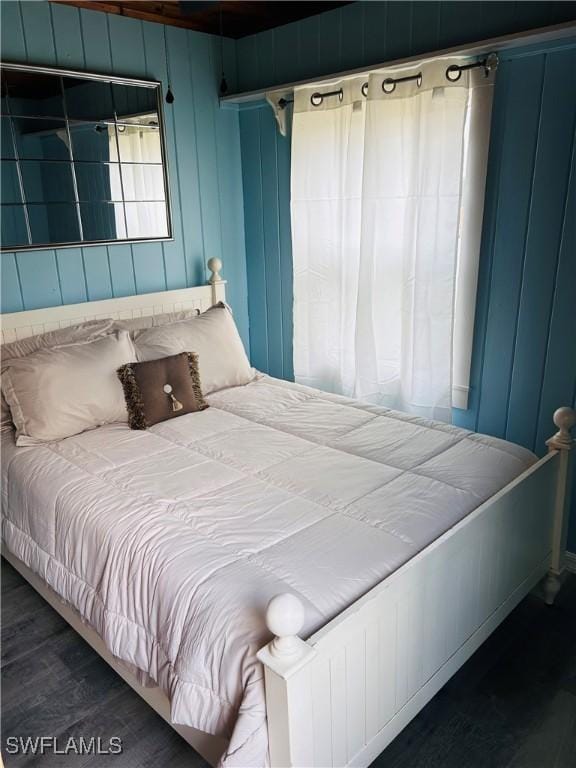 bedroom featuring wood finished floors