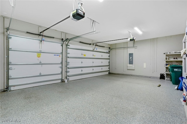 11607 Periwinkle Dr, Naples, FL 34120 - garage featuring electric panel and a garage door opener