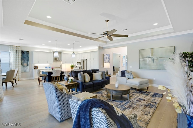 11607 Periwinkle Dr, Naples, FL 34120 - living room with a tray ceiling, light wood finished floors, a ceiling fan, and recessed lighting