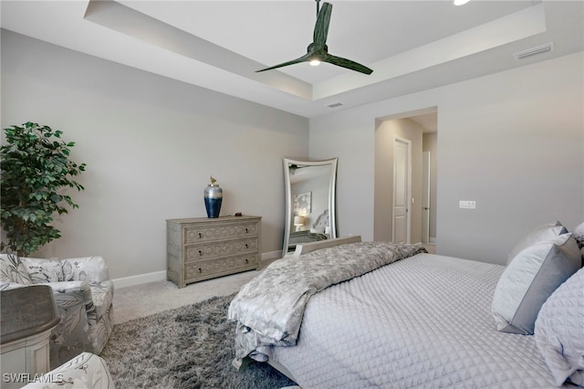 11607 Periwinkle Dr, Naples, FL 34120 - carpeted bedroom with visible vents, baseboards, a raised ceiling, and ceiling fan