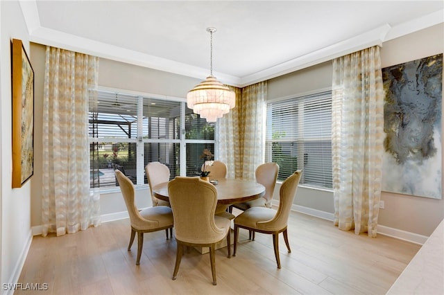 11607 Periwinkle Dr, Naples, FL 34120 - dining space featuring a chandelier, baseboards, and light wood-type flooring