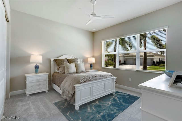 11607 Periwinkle Dr, Naples, FL 34120 - bedroom featuring light carpet, baseboards, and a ceiling fan