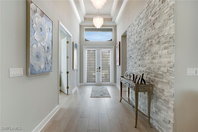 11607 Periwinkle Dr, Naples, FL 34120 - doorway featuring french doors, wood finished floors, crown molding, a chandelier, and baseboards