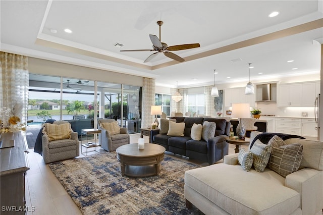 11607 Periwinkle Dr, Naples, FL 34120 - living area featuring ornamental molding, a ceiling fan, recessed lighting, and a raised ceiling