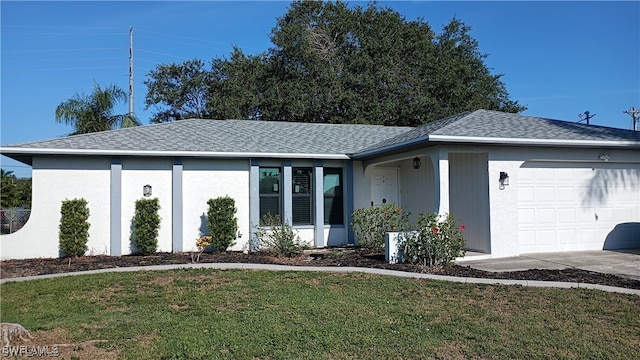 316 SE Santa Barbara Pl, Cape Coral, FL 33990 - ranch-style home with stucco siding, an attached garage, roof with shingles, and a front lawn