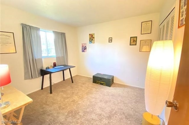 carpeted home office with baseboards and a heating unit