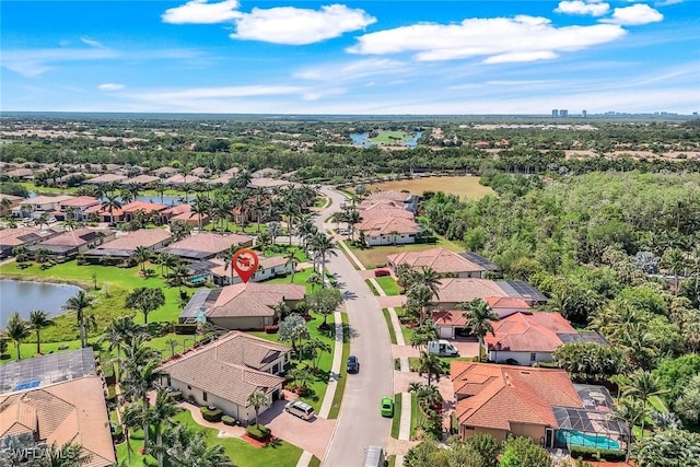 birds eye view of property featuring a water view and a residential view