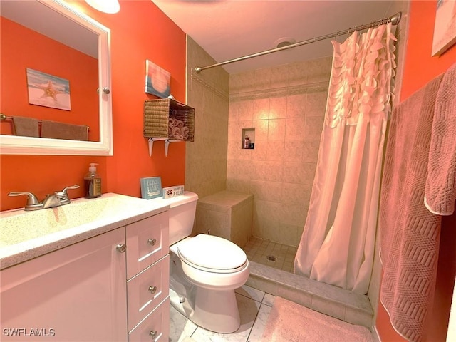 full bathroom with toilet, a stall shower, vanity, and tile patterned floors