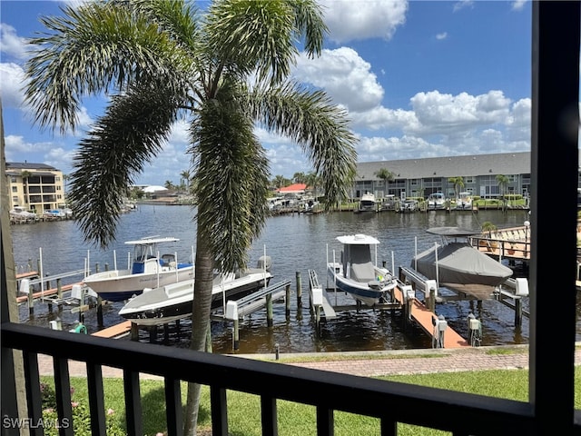 dock area with a water view and boat lift