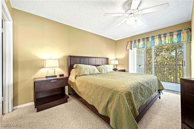carpeted bedroom featuring ceiling fan, baseboards, access to outside, and a textured ceiling