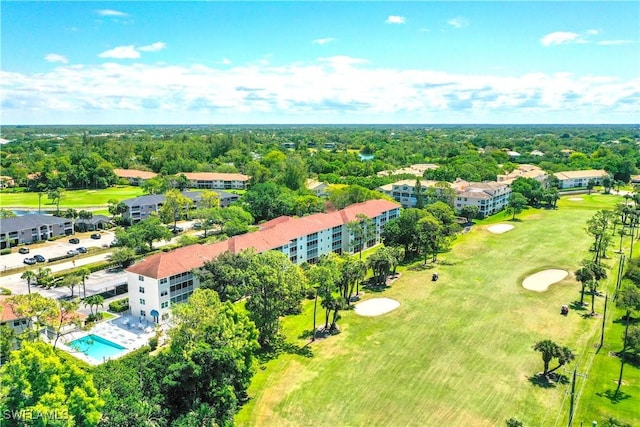 birds eye view of property with view of golf course