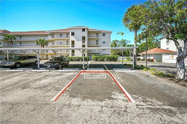 view of partially covered parking lot