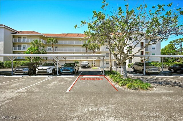481 Quail Forest Blvd Unit B310, Naples, FL 34105 - view of covered parking lot