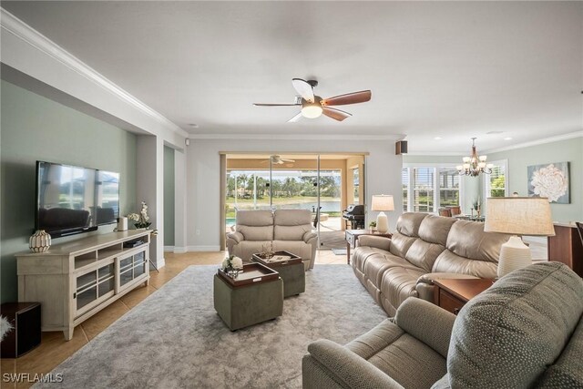 8629 Julia Ln, Naples, FL 34114 - living area featuring ornamental molding, baseboards, tile patterned flooring, and ceiling fan with notable chandelier