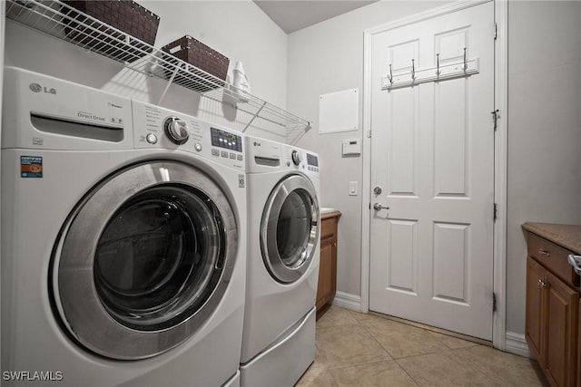8629 Julia Ln, Naples, FL 34114 - washroom featuring laundry area, light tile patterned floors, and washing machine and dryer