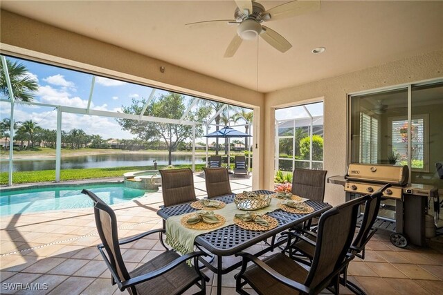 8629 Julia Ln, Naples, FL 34114 - sunroom featuring a water view, a jacuzzi, a ceiling fan, and a pool