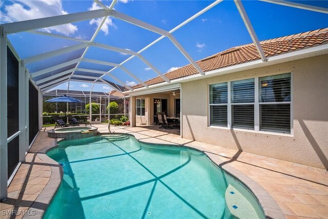 8629 Julia Ln, Naples, FL 34114 - view of swimming pool with a patio area, a pool with connected hot tub, and a lanai