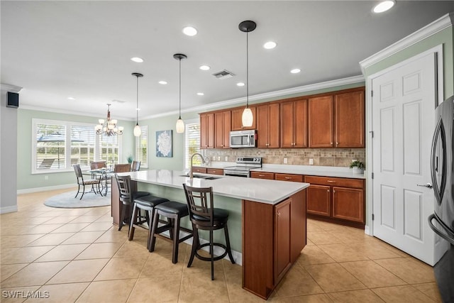 8629 Julia Ln, Naples, FL 34114 - kitchen featuring tasteful backsplash, light tile patterned flooring, visible vents, stainless steel appliances, and a sink
