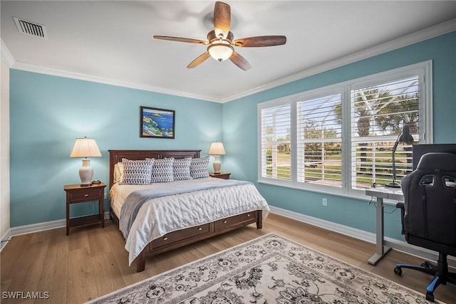 8629 Julia Ln, Naples, FL 34114 - bedroom featuring visible vents, baseboards, crown molding, and wood finished floors