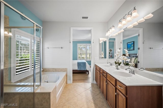 8629 Julia Ln, Naples, FL 34114 - ensuite bathroom featuring tile patterned flooring, ensuite bath, visible vents, and a sink