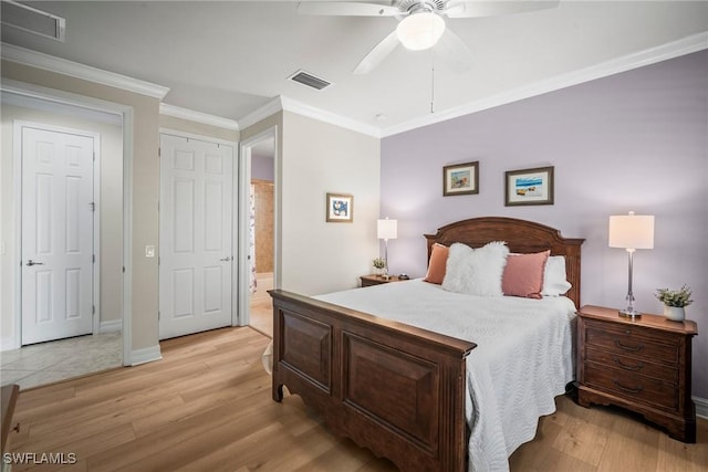8629 Julia Ln, Naples, FL 34114 - bedroom with light wood-style floors, ornamental molding, visible vents, and connected bathroom