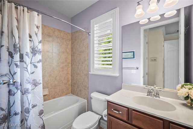 8629 Julia Ln, Naples, FL 34114 - bathroom featuring shower / tub combo with curtain, vanity, and toilet