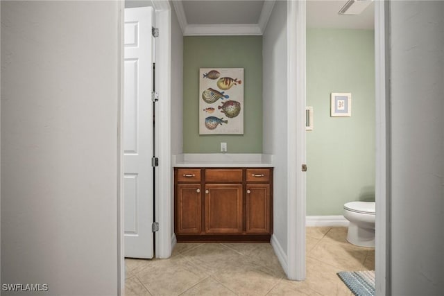 8629 Julia Ln, Naples, FL 34114 - bathroom with toilet, ornamental molding, baseboards, and tile patterned flooring