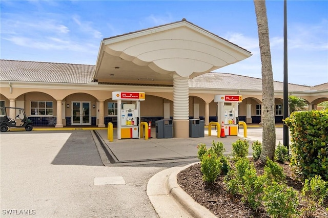 8629 Julia Ln, Naples, FL 34114 - view of building exterior with uncovered parking