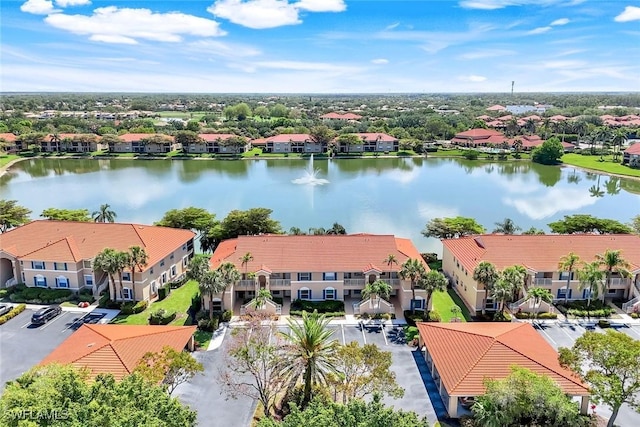 bird's eye view with a residential view and a water view