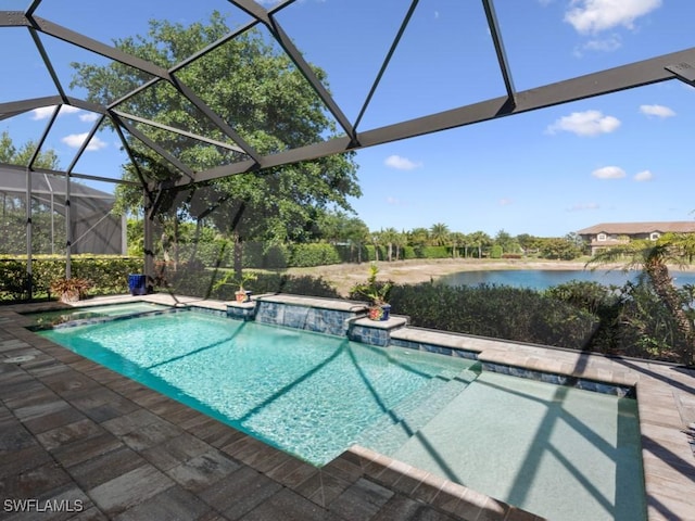 pool featuring a patio, glass enclosure, and a water view