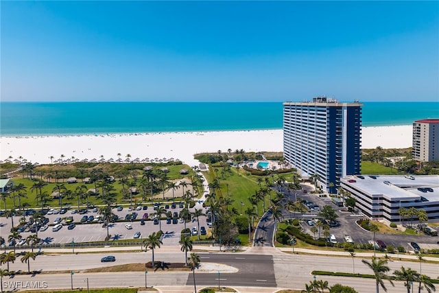 aerial view featuring a view of the beach and a water view