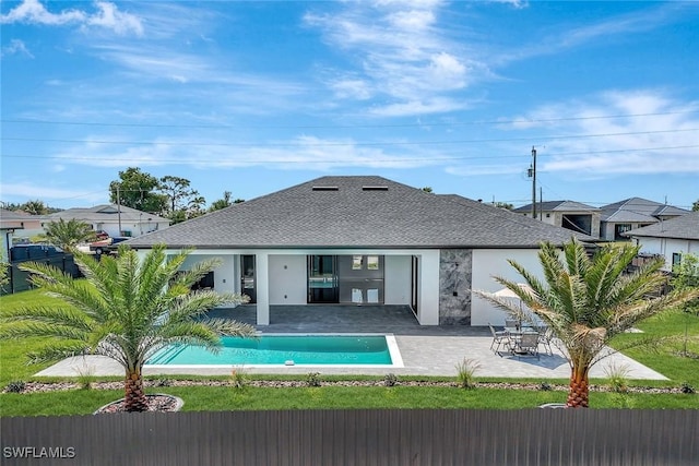 1041 Embers Pkwy W, Cape Coral, FL 33993 - rear view of house featuring a fenced in pool, stucco siding, a patio, and roof with shingles