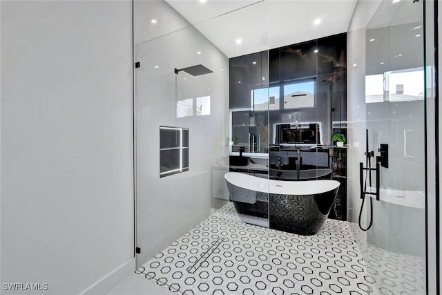 1041 Embers Pkwy W, Cape Coral, FL 33993 - full bathroom with tile patterned flooring, a stall shower, and a soaking tub