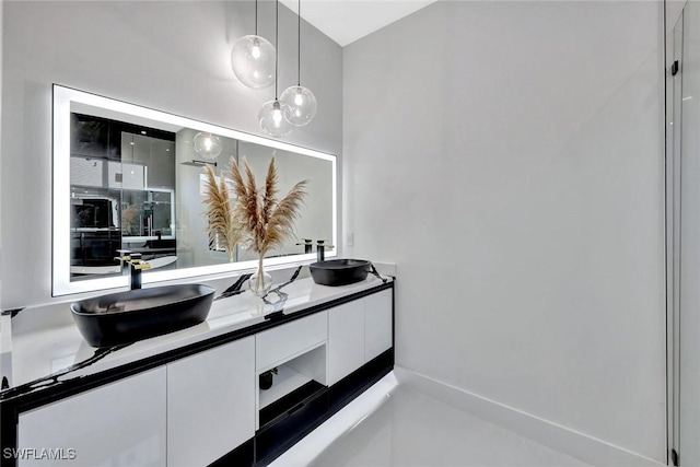1041 Embers Pkwy W, Cape Coral, FL 33993 - full bathroom with double vanity and a sink