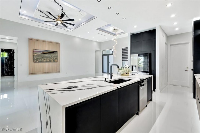 1041 Embers Pkwy W, Cape Coral, FL 33993 - kitchen with light countertops, modern cabinets, a sink, dark cabinetry, and a large island with sink