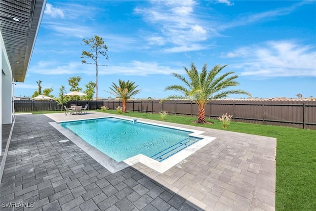 1041 Embers Pkwy W, Cape Coral, FL 33993 - view of pool with a lawn, a fenced in pool, a fenced backyard, and a patio area