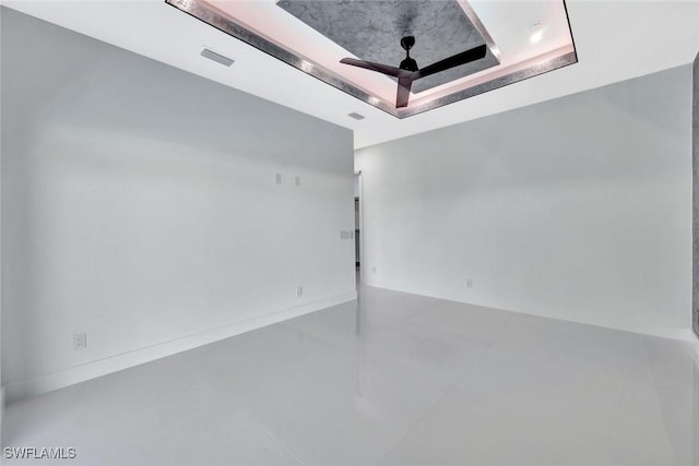 1041 Embers Pkwy W, Cape Coral, FL 33993 - spare room featuring baseboards, visible vents, finished concrete floors, and a raised ceiling
