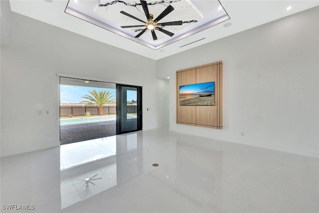 1041 Embers Pkwy W, Cape Coral, FL 33993 - tiled spare room with a high ceiling, a ceiling fan, and a raised ceiling