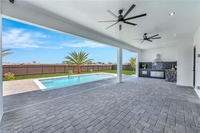 1041 Embers Pkwy W, Cape Coral, FL 33993 - view of pool featuring a ceiling fan, a fenced backyard, a fenced in pool, an outdoor kitchen, and a patio area