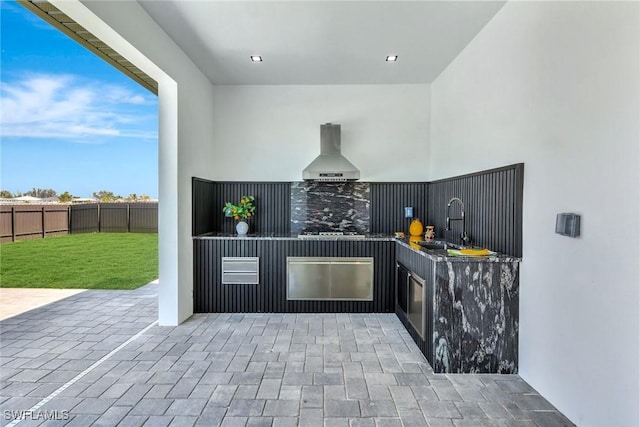 1041 Embers Pkwy W, Cape Coral, FL 33993 - view of patio featuring exterior kitchen, a sink, and fence