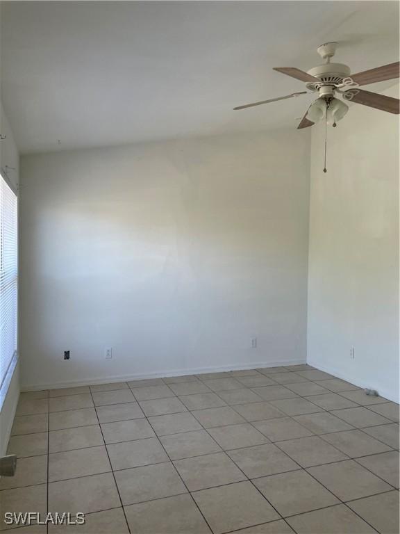 spare room featuring a ceiling fan