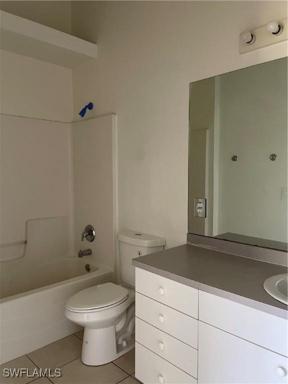 bathroom with shower / bathing tub combination, tile patterned floors, toilet, and vanity