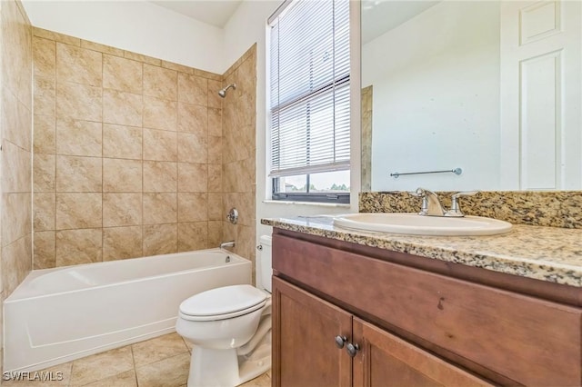 full bath featuring toilet, bathing tub / shower combination, vanity, and tile patterned flooring