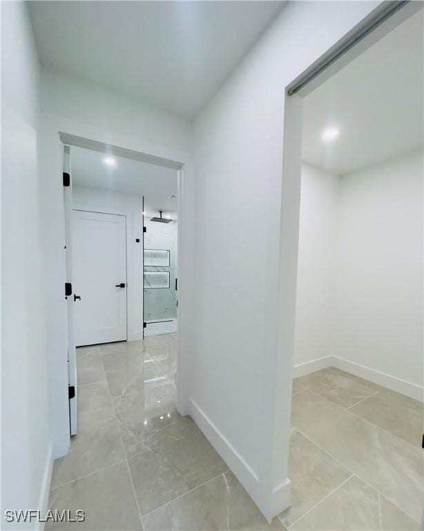 856 Jaguar Blvd, Lehigh Acres, FL 33974 - corridor featuring baseboards