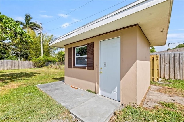 48 Victoria Dr, North Fort Myers, FL 33917 - view of outdoor structure featuring fence and an outdoor structure