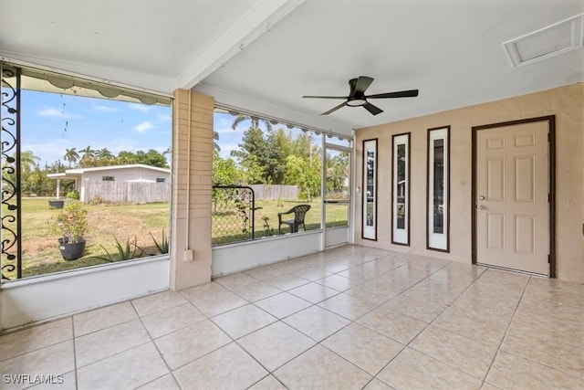 48 Victoria Dr, North Fort Myers, FL 33917 - unfurnished sunroom with a wealth of natural light, beam ceiling, and ceiling fan