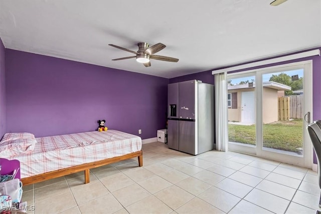 48 Victoria Dr, North Fort Myers, FL 33917 - bedroom with stainless steel fridge with ice dispenser, baseboards, access to outside, and light tile patterned flooring