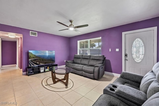 48 Victoria Dr, North Fort Myers, FL 33917 - living room featuring light tile patterned flooring, baseboards, visible vents, and ceiling fan