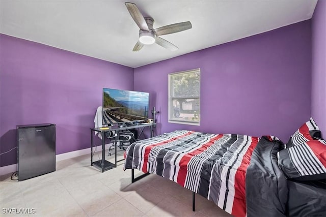 48 Victoria Dr, North Fort Myers, FL 33917 - bedroom featuring baseboards, tile patterned flooring, and a ceiling fan